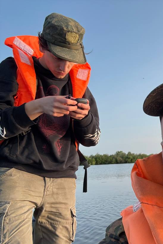 Checking the route on a phone in the boat